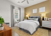 Thumbnail 10 of 34 - our apartments offer a bedroom with a king size bed at The Villas at Prairie Center, Colorado, 80601