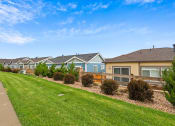 Thumbnail 22 of 34 - a row of houses in a suburban neighborhood at The Villas at Prairie Center, Colorado, 80601