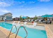 Thumbnail 26 of 34 - take a dip in the resort style pool at The Villas at Prairie Center, Brighton, Colorado