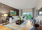 Thumbnail 9 of 44 - a living room with brown walls and a sliding glass door leading to a balcony