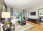 Thumbnail 8 of 44 - a living room with a white couch and a tv on the wall
