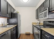 Thumbnail 7 of 40 - kitchen with black appliances