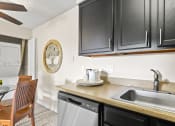 Thumbnail 6 of 40 - the kitchen of our studio apartment has a sink and a dishwasher at Silver Reef Apartments, Colorado