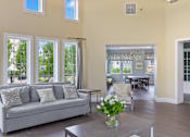Thumbnail 14 of 30 - a living room filled with furniture and a large window at Cirrus Apartments, Ashland, MA, 01721