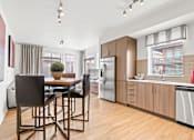 Thumbnail 5 of 39 - a kitchen and dining area at 8000 Uptown Apartments, Broomfield, Colorado