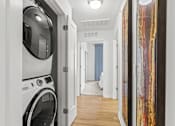 Thumbnail 20 of 39 - a laundry room with a washer and dryer at 8000 Uptown Apartments, Colorado 80021