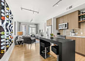 Thumbnail 4 of 39 - a kitchen and living room at 8000 Uptown Apartments, Broomfield, Colorado