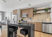 Thumbnail 2 of 39 - a kitchen and dining area at 8000 Uptown Apartments, Broomfield
