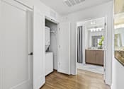 Thumbnail 19 of 39 - a bedroom with a medium hardwood floor and white walls at 8000 Uptown Apartments, Colorado