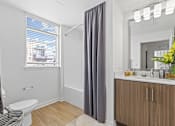 Thumbnail 14 of 39 - a bathroom with a toilet sink at 8000 Uptown Apartments, Broomfield