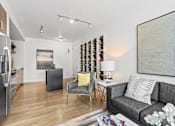 Thumbnail 11 of 39 - a living room with a couch and two chairs at 8000 Uptown Apartments, Broomfield, CO