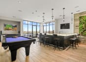 Thumbnail 12 of 35 - a large room with a pool table and a bar