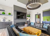 Thumbnail 9 of 35 - a living room with black leather couches and a wooden coffee table