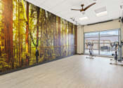 Thumbnail 24 of 35 - a yoga studio with a large mural of a forest