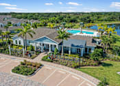 Thumbnail 42 of 46 - an aerial view of a house with a swimming pool and tennis court at Artesia at Lakewood Ranch Apartments, Bradenton