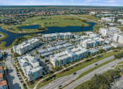Thumbnail 64 of 65 - A bird's eye view of a residential area with a large lake in the foreground. at Centre Pointe Apartments, Melbourne