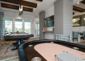 Thumbnail 15 of 46 - a game room with a pool table and a television at Artesia at Lakewood Ranch Apartments, Bradenton, FL