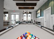 Thumbnail 14 of 46 - a pool table in a living room with a bunch of balls on it at Artesia at Lakewood Ranch Apartments, Bradenton, Florida