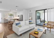 Thumbnail 8 of 40 - a living room with a white couch and a coffee table at Odyssey, Fort Myers, FL, 33905