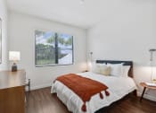 Thumbnail 17 of 40 - a bedroom with a bed and a window at Odyssey, Florida, 33905