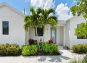 Thumbnail 28 of 40 - a white house with a palm tree in front of it at Odyssey, Florida, 33905