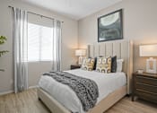 Thumbnail 18 of 37 - an overview of a bedroom with a bed and a window at Soleil at Canyon Trails Apartments, Arizona