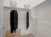 Thumbnail 22 of 37 - a closet with wooden steps and a black jacket hanging on the wall at Soleil at Canyon Trails Apartments, Goodyear, AZ, 85338