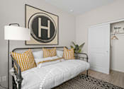Thumbnail 23 of 37 - a white bedroom with a white bed and yellow pillows at Soleil at Canyon Trails Apartments, Goodyear