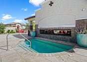 Thumbnail 32 of 37 - a swimming pool in front of a house with a pool at Soleil at Canyon Trails Apartments, Goodyear, Arizona