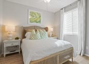 Thumbnail 9 of 43 - a bedroom with a large bed and a window at Sienna at South Mountain Apartments, Laveen, AZ, 85339
