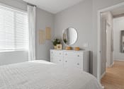 Thumbnail 10 of 43 - bedroom with mirror and dresser at Sienna at South Mountain Apartments, Arizona, 85339