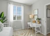 Thumbnail 30 of 43 - a bedroom with a bed and a desk and a window at Sienna at South Mountain Apartments, Laveen, Arizona