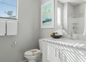 Thumbnail 26 of 43 - a white bathroom with a sink and a toilet at Sienna at South Mountain Apartments, Laveen, 85339