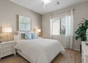 Thumbnail 23 of 43 - a bedroom with a bed and a window at Sienna at South Mountain Apartments, Laveen, AZ