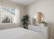 Thumbnail 25 of 43 - a bedroom with a large white bed and a window at Sienna at South Mountain Apartments, Arizona, 85339
