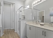 Thumbnail 27 of 43 - a bathroom with a shower and a sink and a mirror at Sienna at South Mountain Apartments, Arizona