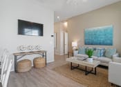 Thumbnail 22 of 43 - a living room with a couch and a table at Sienna at South Mountain Apartments, Laveen, AZ, 85339