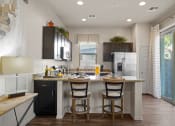 Thumbnail 4 of 36 - a kitchen with a island with two chairs and a refrigerator at Bella Grace, Arizona