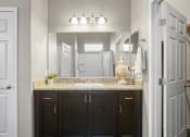 Thumbnail 13 of 36 - a bathroom with a sink and a mirror at Bella Grace, Chandler, AZ