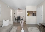 Thumbnail 5 of 24 - a living room and dining room with a couch and a table