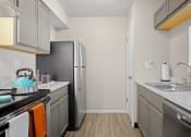 Thumbnail 3 of 24 - the preserve at ballantyne commons apartment kitchen with stainless steel appliances