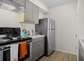 Thumbnail 1 of 24 - the preserve at ballantyne commons apartment kitchen with stainless steel appliances and a refrigerator