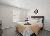 Thumbnail 11 of 24 - a bedroom with a bed and a window