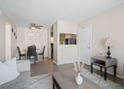 Thumbnail 6 of 24 - the living room and dining area of a apartment with a couch and a table