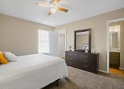 Thumbnail 12 of 29 - bedroom with orange and blue pillows on bed