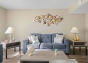 Thumbnail 9 of 29 - blue couch and brown table with two side tables