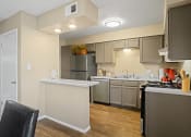 Thumbnail 5 of 29 - view looking into kitchen with breakfast bar and light brown cabinets