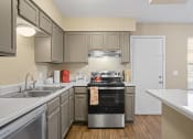 Thumbnail 1 of 29 - view looking into kitchen with breakfast bar and light brown cabinets
