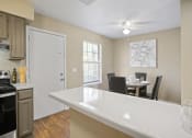 Thumbnail 7 of 29 - breakfast bar in kitchen with dining room area behind it