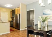 Thumbnail 19 of 49 - a kitchen and dining area in a 555 waverly unit at Skye at Arbor Lakes, Minnesota, 55369